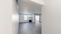Located at 312 McBrien Rd in Chattanooga, Tennessee, this single-story, 3-bedroom, 2-bathroom home offers a well-organized layout across a comfortable footprint. The living room serves as the heart of the home, featuring a tiled fireplace with a classic mantel, light gray laminate flooring, and windows fitted with blinds that allow natural light to filter in. Dark accent trim along the walls adds a clean, modern contrast to the bright white walls throughout.

The kitchen is a standout space, designed in a galley style with gray cabinetry, marble-look countertops, white subway tile backsplash, a stainless steel double-basin sink, and matching stainless steel appliances. A tray ceiling with flush-mount lighting adds depth and brightness to the room, while a walk-in pantry or closet provides additional storage.

The three bedrooms are carpeted for comfort, with the primary bedroom offering a generous footprint and ample wall space. Additional bedrooms feature windows with outdoor views, filling the rooms with natural light.

The two bathrooms are finished with light wood-look tile flooring. One bathroom includes a vanity with a marble-look countertop, dark cabinetry, and a shower-tub combo. The second bathroom offers a clean, simple layout with a shower-tub unit. Two closets provide convenient storage throughout the home.