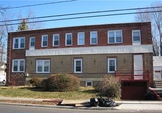 Building Photo - 100 E Holly Ave