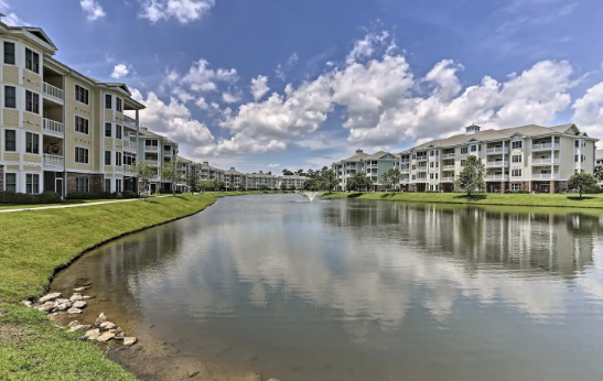 Unit overlooks a large pond and walking path - 4861 Luster Leaf Cir