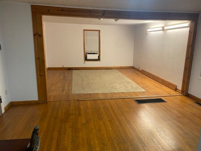 View from laundry room into dining room/living room - 118 Harford Rd