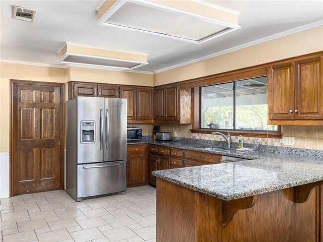 Building Photo - Best priced executive custom home in Rockd...