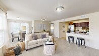 Located at 2737 NW 140th St in Oklahoma City, OK, this well-appointed 2-bedroom, 3-bathroom single-floor residence offers a thoughtfully designed open-concept layout that maximizes comfort and functionality. The living room serves as the heart of the home, featuring plush wall-to-wall carpeting, a classic fireplace flanked by windows that invite natural light, and a seamless flow into the dining and kitchen areas. The kitchen is well-equipped with rich dark wood cabinetry, granite-look countertops, stainless steel appliances including a refrigerator, range, and built-in microwave, and durable tile flooring — ideal for everyday cooking and entertaining. The generously sized primary bedroom provides a private retreat, complete with a ceiling fan, natural light from window blinds, and ample closet space. The second bedroom is equally comfortable, also featuring carpet flooring and natural light. Two dedicated closets provide excellent storage throughout. A utility area with washer/dryer hookups adds everyday convenience. With warm neutral tones, consistent finishes, and a practical single-level floor plan, this residence delivers a cohesive and livable environment suited to a variety of lifestyles.