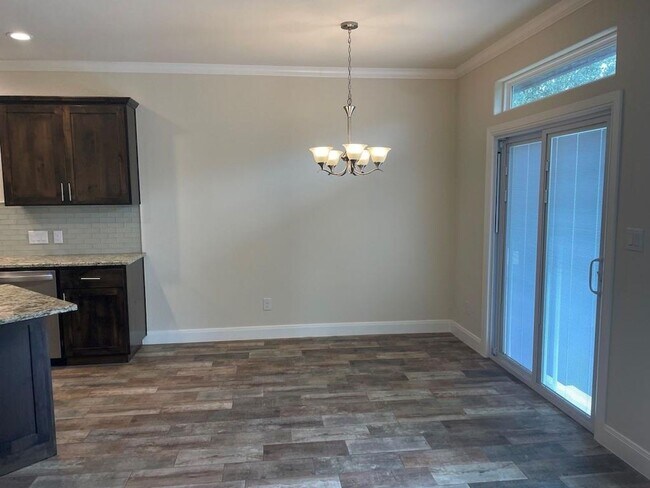 Building Photo - Enjoy the upscale construction of this pro...