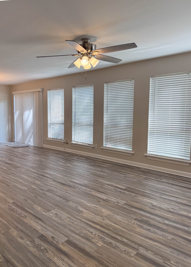 Living space leading into dining area - 8300 Scottingham Dr