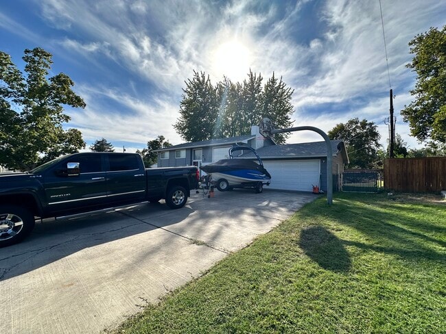 Side view with gate leading g to the back yard. - 219 Thayer Dr