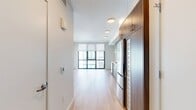 This 320 square foot studio apartment in San Francisco exemplifies efficient urban living. The space features a single floor with an open concept design, seamlessly integrating living, sleeping, and dining areas. The modern kitchen is a standout element, boasting sleek wood-grain cabinetry, stainless steel appliances, and a compact yet functional layout. Recessed lighting throughout adds a contemporary touch and enhances the sense of space.

The bathroom, while compact, is thoughtfully designed with clean lines and essential fixtures, including a toilet, sink, and bathtub with shower. The use of white tiles and surfaces contributes to a bright, airy feel.

Large floor-to-ceiling windows dominate one wall, flooding the space with natural light and offering expansive city views. The light-colored hardwood flooring unifies the entire apartment, reflecting light and creating an illusion of more space. White walls further enhance the bright, open atmosphere.

Despite its small footprint, the apartment's layout feels spacious and uncluttered, ideal for single occupancy or a couple seeking a minimalist urban lifestyle. The property's location at 1532 Harrison Street places residents in the heart of San Francisco, providing easy access to the city's amenities and vibrant culture.