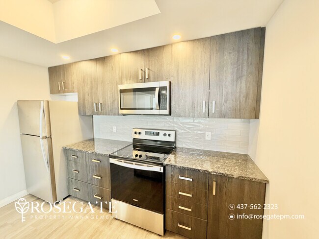 Photo du bâtiment - Modern 1-Bedroom Condo with Balcony in Dow...