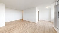 Located on the 8th floor at 3390 Keele Street in Toronto, this well-appointed 2-bedroom, 1-bathroom unit offers a clean, modern aesthetic throughout. Light wood laminate flooring runs seamlessly across all living areas, complementing the crisp white walls and creating a bright, cohesive feel.

The galley-style kitchen is efficiently designed with white cabinetry, subway tile backsplash, stainless steel appliances including a full-size refrigerator, and ample upper storage. It opens toward the living area, which benefits from large windows and a glass balcony door that floods the space with natural light and provides access to outdoor views of the surrounding neighbourhood and greenery.

Both bedrooms are well-sized, with the primary bedroom offering generous proportions and large windows that frame pleasant views. The second bedroom also features a bright window and light-filled atmosphere. Multiple closet doors are present in the bedrooms, providing practical storage.

The bathroom is finished with white subway tile surrounding the soaker tub and shower, a white vanity with countertop, and neutral floor tile — delivering a clean, classic look. A hallway connects all rooms in a functional layout. The private balcony completes this inviting unit, offering a comfortable outdoor retreat above the city.