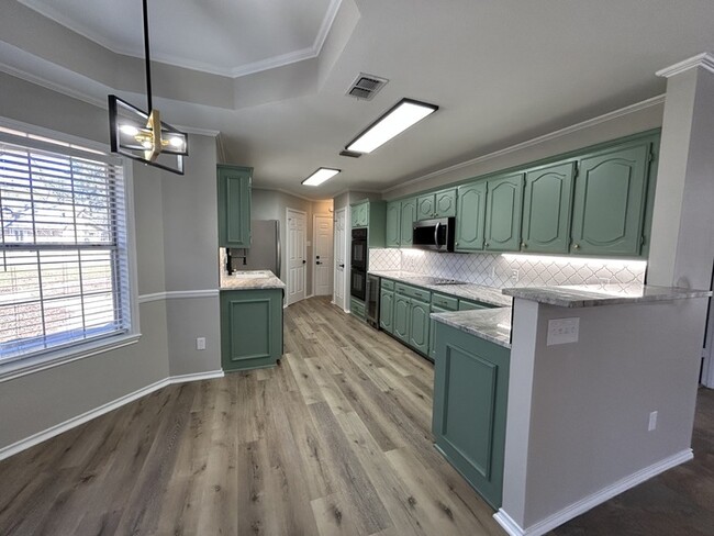 Building Photo - Available Now! Newly Remodeled 3/2/2 in a ...