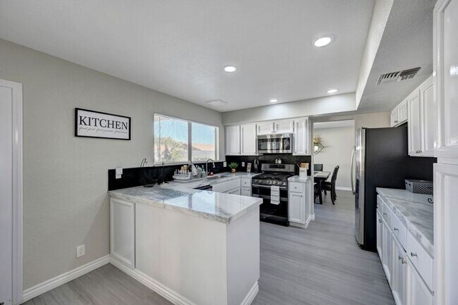 Building Photo - Fully Furnished Entertainer’s Dream with Resort-Style Pool & RV Parking!