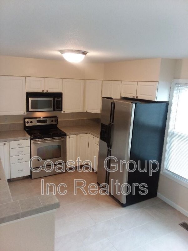 Building Photo - 8550 Tidewater Dr