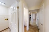 Located in Baldwinsville, NY, this two-story home offers 2 bedrooms and 3 bathrooms across two well-organized floors. The main level features a welcoming entrance that flows into hallways connecting the key living spaces. The kitchen is equipped with warm wood cabinetry, white countertops, and a full suite of stainless steel appliances including a range, built-in microwave, and dishwasher, all set over light hardwood-style flooring. The living room is bright and open, showcasing crown molding, a ceiling fan, track lighting, and access to the patio through a sliding glass door. A bathroom on this level features tile flooring, a vanity with a framed mirror, and a tub-shower combination with grab bars. Upstairs, two carpeted bedrooms provide comfort and natural light through wide windows overlooking lush greenery. The spacious primary bedroom offers ample room to furnish. Additional highlights include five closets for generous storage, a utility room, an attached garage with concrete flooring and overhead lighting, and two hallways that ensure smooth circulation throughout. The neutral color palette and clean finishes give the home a bright, move-in-ready feel.