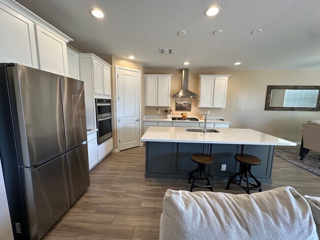 Building Photo - One year old, 3 bedroom, 2.5 bath surround...