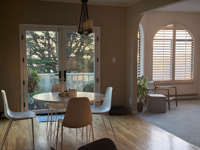 Lower level dining / work area and living room with 85" Samsung Frame, and DWRComo Seatng Dolby Atmo - 84 Levant St