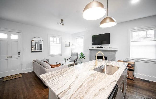 Living area with Google TV that is included. - 309 E Brookland Park Blvd