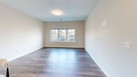 Located at 99 Van Block Ave in Hartford, CT, this 2-bedroom, 1-bathroom residence offers a thoughtfully designed single-floor layout with modern finishes throughout. The open-concept kitchen serves as the heart of the home, featuring white shaker cabinetry, granite countertops, stainless steel appliances including a range, microwave, dishwasher, and refrigerator, and a peninsula with pendant lighting that provides additional seating and workspace. Hardwood-style flooring runs seamlessly throughout the unit, lending a clean and cohesive aesthetic. The living area is bright and open, flowing naturally from the kitchen. Both bedrooms are comfortably sized, with the primary bedroom offering ample room and a dedicated closet with built-in hanging storage. Windows in the bedrooms invite in natural light and provide views of the surrounding neighborhood. The full bathroom is neatly finished with wood-look flooring, a white vanity, and a shower with curtain, accented by brushed nickel hardware. Neutral wall tones and clean white trim throughout the residence create a fresh, move-in-ready atmosphere. A dedicated closet adds practical storage, completing this efficiently laid-out and well-finished Hartford home.