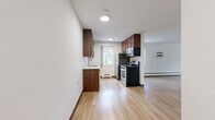 This well-designed 710 square foot apartment in Minneapolis offers a harmonious blend of comfort and functionality. The spacious living area is adorned with gleaming hardwood floors, creating a warm and inviting atmosphere. Large windows flood the space with natural light, enhancing the sense of openness and providing pleasant views of the surrounding area.

The modern kitchen is a highlight, featuring rich wood cabinetry, stainless steel appliances, and ample counter space. It's equipped with a gas range, dishwasher, and refrigerator, making meal preparation a breeze. The bathroom is clean and contemporary, with white tile work, a combination tub and shower, and additional storage space.

The bedroom, measuring 190 square feet, is generously sized and includes a spacious closet for storage. Plush carpeting in the bedroom adds comfort underfoot. The apartment's efficient layout maximizes the use of space, with thoughtful details like baseboard heating for year-round comfort.

Located at 3701 W Lake St in Minneapolis, this apartment offers a convenient urban living experience. The single-floor layout and updated features make it an ideal choice for those seeking a modern, low-maintenance home in a vibrant city setting.