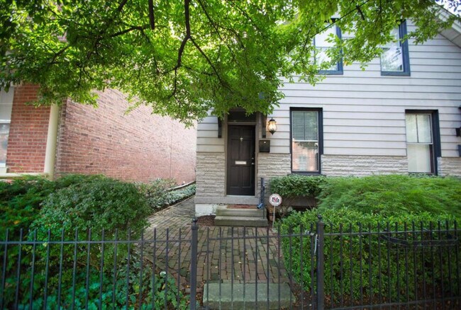 A brick path leads to this welcoming entrance. - 715 S 5th St