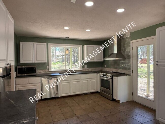 Foto del edificio - 18633 River Woods Dr