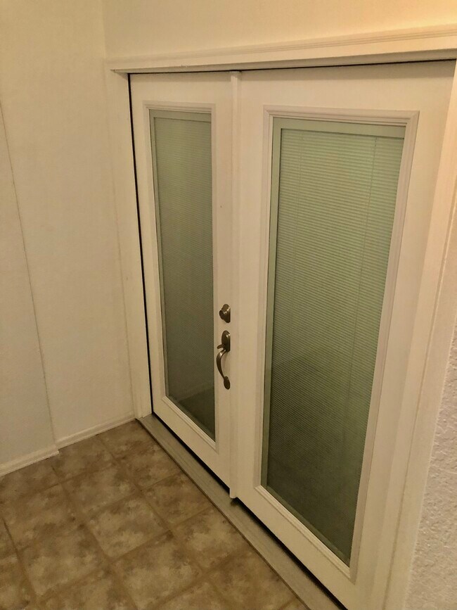 Entrance through locking French doors - 6260 Montarbor Dr