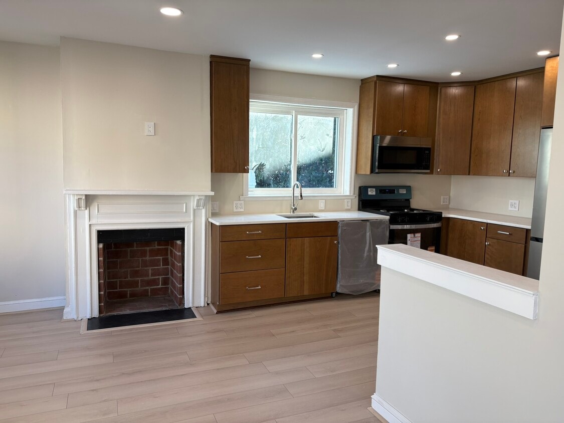 Open kitchen with decorative fireplace - 1514 31st St NW