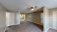 Located at 5151 Highland Rd in Baton Rouge, Louisiana, this single-floor residence offers 2 bedrooms and 3 bathrooms within a well-organized, functional layout. The living area features dark hardwood-style flooring, neutral taupe walls, and a ceiling fan, with a window that allows natural light to filter in and brighten the space.

The kitchen is equipped with white cabinetry featuring decorative paneling, light-toned countertops, a double sink, and white appliances including a range, dishwasher, and refrigerator. Recessed lighting provides a clean, well-lit workspace, and a peninsula with vertical panel detailing offers additional prep and storage space.

The primary bedroom is a comfortable, generously sized retreat with plush carpeting, a ceiling fan, and closet access. The second bedroom also features carpet flooring, neutral walls, and a ceiling fan, with a window providing natural light. Both rooms offer a calm, functional atmosphere.

The three bathrooms include tub-shower combinations with white tile surrounds and brushed nickel fixtures. The primary bath features a vanity with a marble-style countertop, white cabinetry, and a dedicated closet nearby. Throughout the residence, consistent neutral tones, wood-look flooring in common areas, and carpeted bedrooms create a cohesive and comfortable living environment.