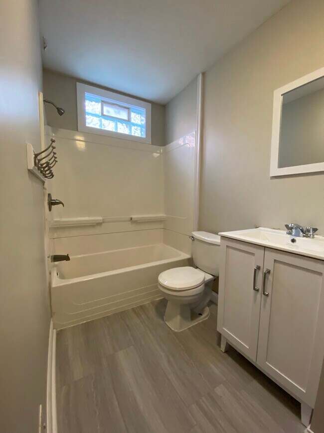 bathroom with new vanity and vinyl floor - 2620 14th Ave S