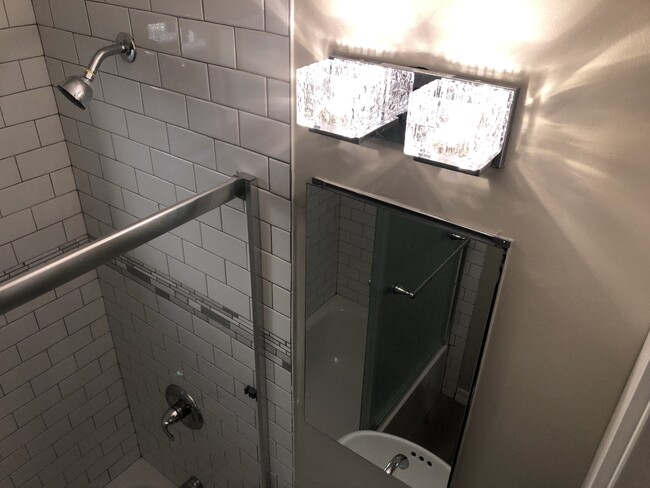 That glass lights subway tile shower - 346 Rose Ave