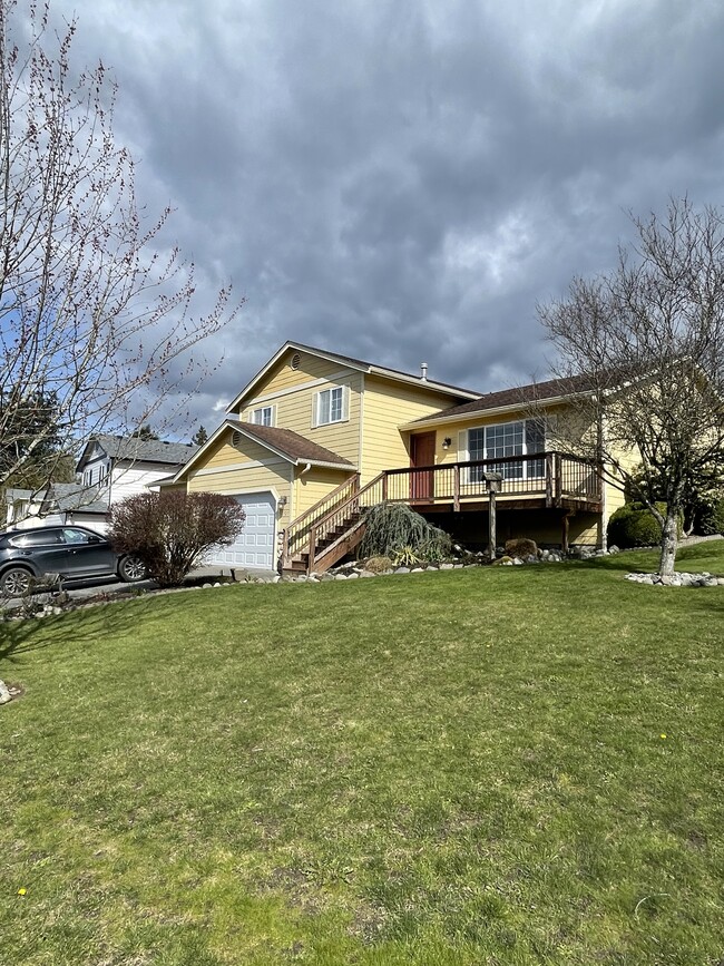 Street view with front porch deck - 7927 263rd Pl NW