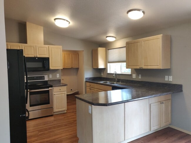 Building Photo - Charming 4-Bedroom Home on 1/2 Acre with a Fenced Backyard, Fully Insulated Double-Car Garage, in...