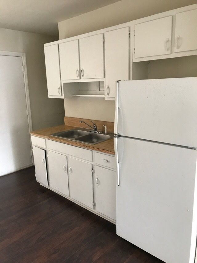 Building Photo - End Unit -Garden-Style Living