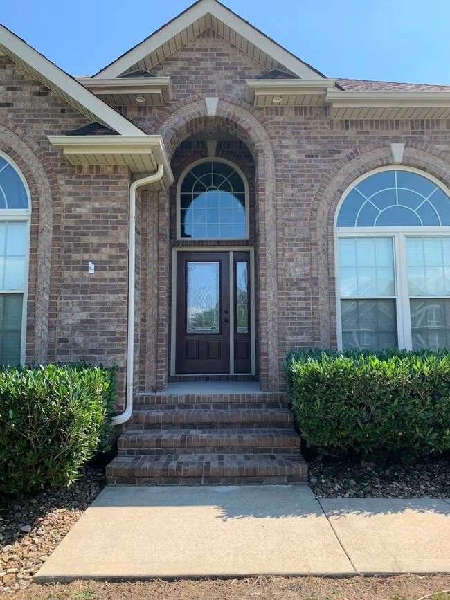 Building Photo - Luxury Living! Beautiful Brick Home in Sango with 3 car garage.