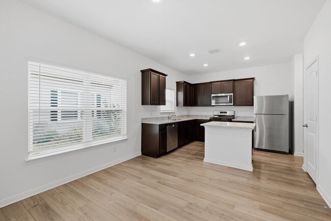 Building Photo - Clean & Modern Townhome with No Carpet and Lawn Service Included