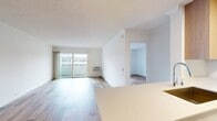 This 680 square foot apartment in Newport Beach offers a harmonious blend of comfort and contemporary design. The single-floor layout features one bedroom measuring 180 square feet, providing ample space for relaxation. The open-concept living area seamlessly integrates with the kitchen, creating a spacious atmosphere ideal for both everyday living and entertaining.

The kitchen boasts modern amenities, including stainless steel appliances and light wood cabinetry, complemented by a practical layout with ample counter space. Throughout the apartment, gleaming hardwood floors add warmth and elegance, while large windows allow natural light to flood the space, enhancing the sense of openness.

The bathroom, while compact, is efficiently designed with modern fixtures and a combination bathtub and shower. A notable feature is the private balcony, offering a perfect spot for enjoying the coastal air and extending the living space outdoors.

The apartment's neutral color palette, predominantly in whites and light tones, creates a clean, fresh ambiance that serves as a blank canvas for personal decorating styles. Ceiling fans in the main living areas provide additional comfort and air circulation.

Located in the desirable Eight 80 Newport Beach complex, this apartment combines the convenience of urban living with the relaxed atmosphere of a coastal community, making it an ideal residence for those seeking a modern, low-maintenance lifestyle in a prime Southern California location.