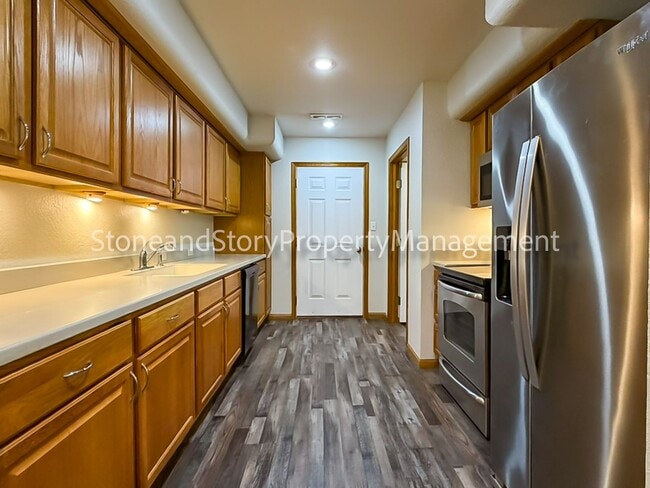 Building Photo - 2 bedroom 1.5 bath duplex with sunroom, 2 car garage and fenced yard