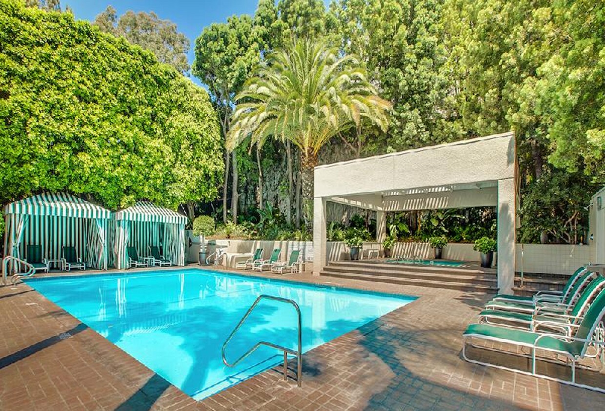The pool and hot tub, sheltered in plant privacy, also with cabanas and an outdoor shower - 1131 Alta Loma Rd