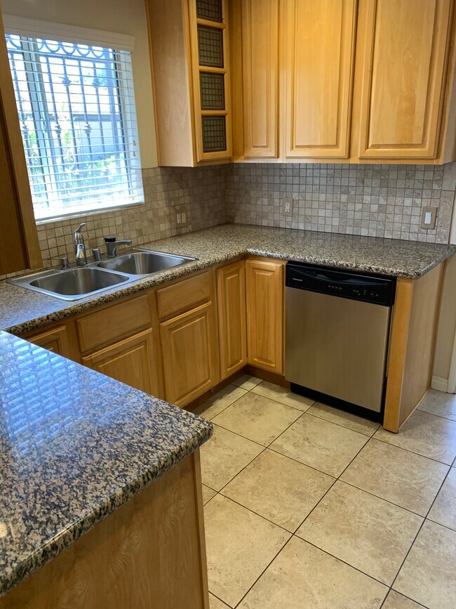 Spacious Kitchen overlooking the Private Yard - 8260 Willoughby Ave