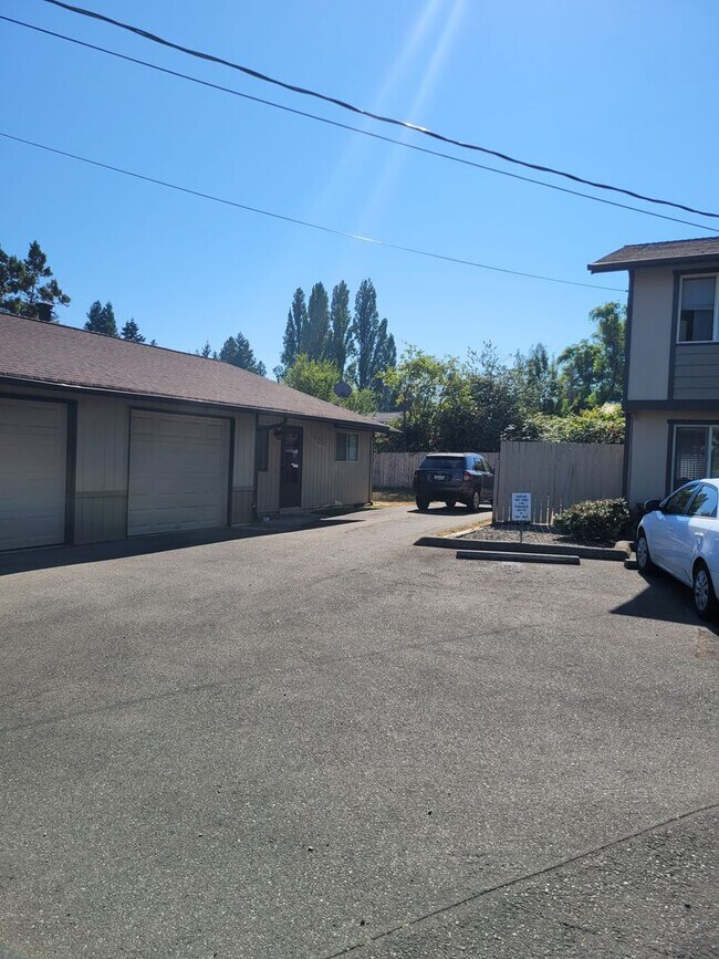 Building Photo - Updated side by side duplex with an attach...