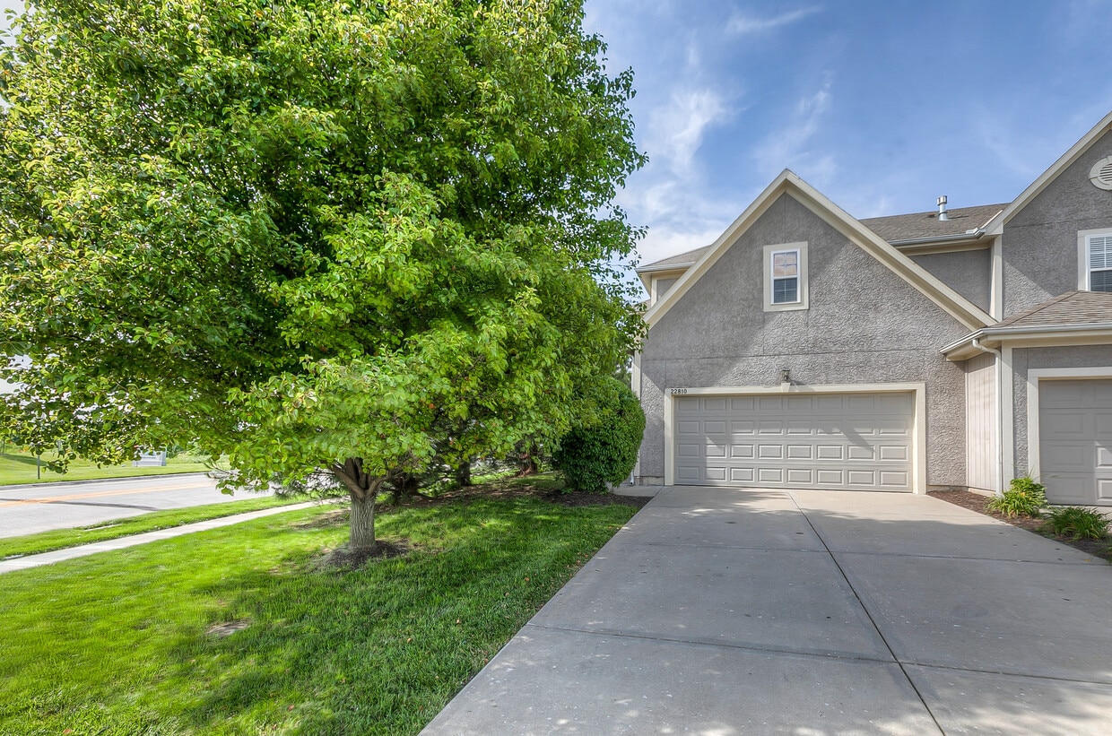 End unit with side front door. - 22810 West 71st Terrace