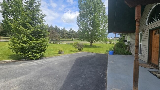 Building Photo - Out of town house with double garage and l...
