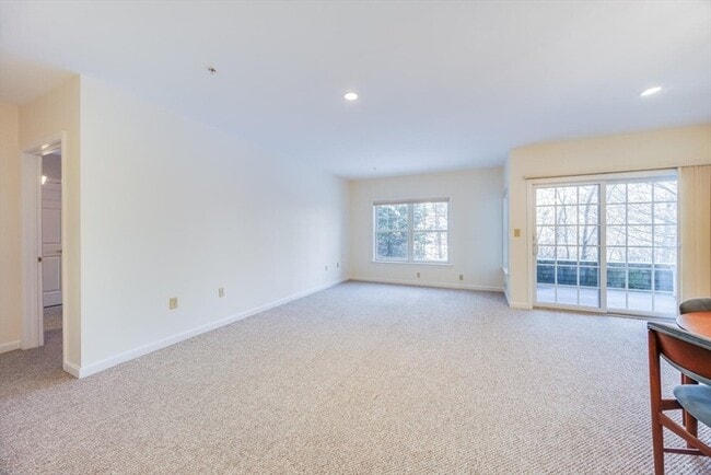 Building Photo - Updated 2BR Condo with Balcony, Garage Parking & Resort-Style Amenities