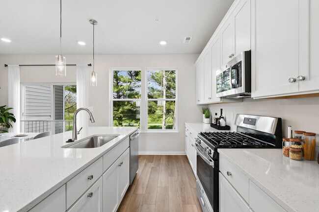 Natural light highlights every detail in this stylish kitchen. - Everstone at Cedar Hill