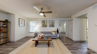 Located at 4819 North Galloway Avenue in Mesquite, TX, this one-bedroom, one-bathroom residence offers a well-designed single-floor layout that maximizes comfort and functionality. The open-concept living, dining, and kitchen area serves as the heart of the home, featuring light wood-style flooring, a textured ceiling, and a tile-surround fireplace that anchors the living space. Multiple windows allow natural light to pour in, enhancing the bright, airy atmosphere throughout. A ceiling fan adds to the comfort of the space.

The kitchen is thoughtfully laid out with white cabinetry, a subway tile backsplash, light countertops with a breakfast bar overhang, a double sink, and black appliances including a refrigerator, range, and dishwasher. Built-in shelving near the living area provides additional storage and display space.

The bedroom offers plush carpeting, a generous closet, and a window with an exterior view, creating a calm and restful retreat. A ceiling fan is also present in this room. The bathroom includes a tub-shower combination and light wood-style flooring. The unit also features a dedicated laundry area and three closets, providing ample storage throughout.