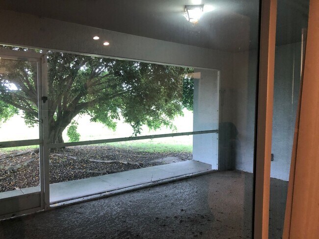 Photo - Experience this 3 bedroom 2 bath duplex with 1 car garage and screened in Lanai. House