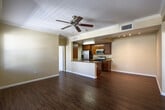Located at 1551 Summerland St in Chula Vista, CA, this well-appointed 2-bedroom, 4-bathroom home offers a thoughtfully designed single-level layout. The open-concept living and dining area is anchored by rich hardwood flooring, crown molding, and a ceiling fan, creating a warm and inviting atmosphere. Large windows allow natural light to fill the space, with views to two private balconies that extend the living area outdoors.

The kitchen is equipped with stainless steel appliances, including a refrigerator, microwave, and gas range, complemented by rich wood cabinetry and granite countertops. A peninsula with a double sink provides additional workspace and a natural divide between the kitchen and dining area.

Both bedrooms feature plush carpeting, generous closet space, and windows that bring in ample natural light. The primary bedroom includes its own dedicated bathroom. The additional bathrooms are finished with granite-topped vanities, tile flooring, and soaking tub-shower combinations.

A dedicated laundry area with in-unit washer and dryer adds everyday convenience. With four closets distributed throughout, storage is plentiful. The warm, neutral color palette and consistent finishes throughout give this home a cohesive, move-in-ready appeal.