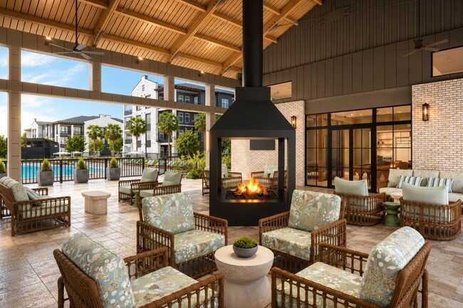An open-air retreat made for connection. Whether it's morning coffee or starlit evenings by the fire. - Brooking Square Apartments & Townhomes