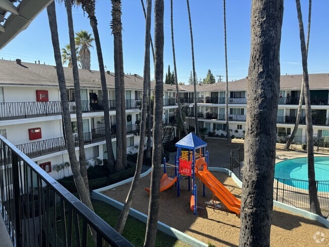 Pool & Playground - Oasis Apartments