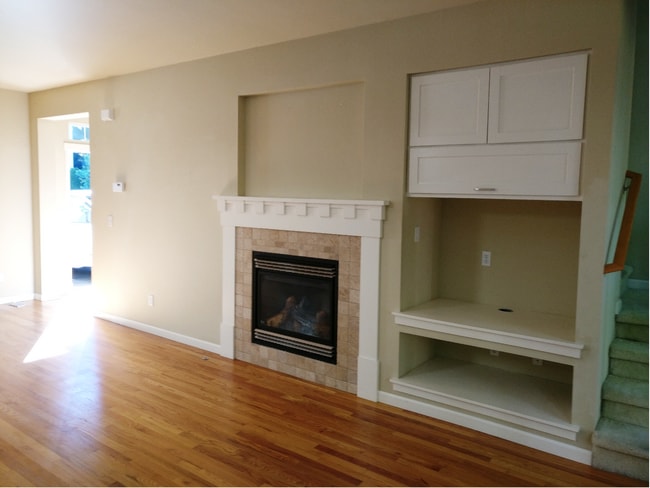 Living Room view with fireplace and storage - 8729 233rd Pl NE