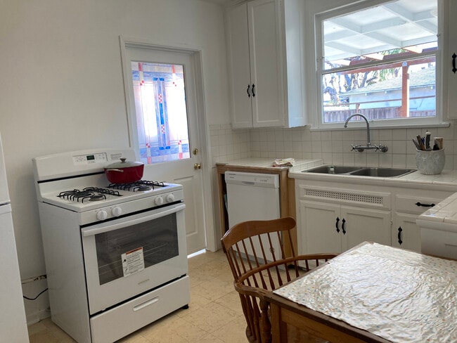 Kitchen w door to laundry - 11924 Tennessee Pl