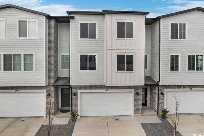 Building Photo - Beautiful New Build Townhome with Attached...